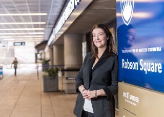 Janet Hutton poses with new Robson Square signage