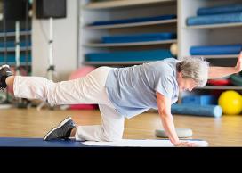 Senior person doing floor exercises