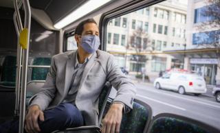 Man in suit on bus